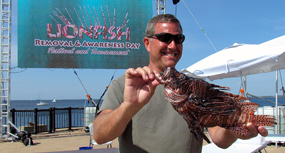 Charles Mayling with largest lionfish ever caught in the Gulf: 44.5 cm (17.5 inches). Image; Alicia Wellman.