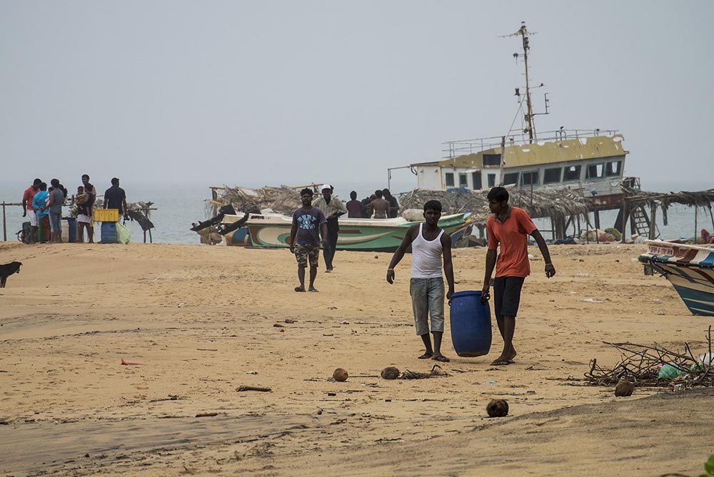 Sri Lankan marine fish collectors returning from a dive. This trade continues to be an important livelihood in coastal communities