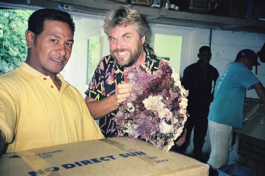 Walt Smith (right) and Hafaka (left) showing off a piece of live rock at the Tonga station in 1991.
