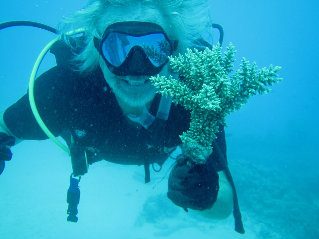Walt Smith, at home underwater working with a Fijian Acropora.