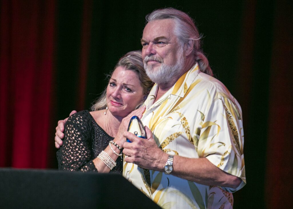 An emotional moment for Deb Smith as her husband Walt, recipient of the 2018 MASNA Pioneer Award for Industry, is completely surprised by the honor and left nearly speechless the night of September 8th, 2018, at MACNA in Las Vegas, NV.