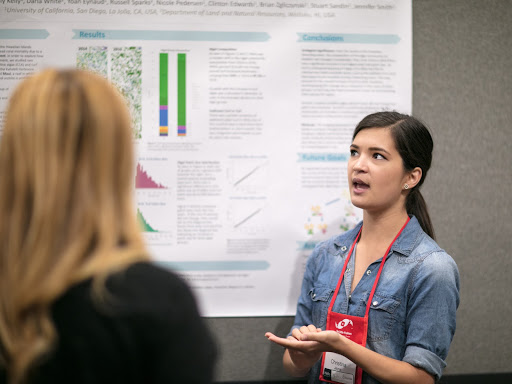 Dozens of individuals, like Christina (pictured) prepared and presented their scientific posters on various marine topics to attendees on the exhibit floor on Friday and Saturday.
