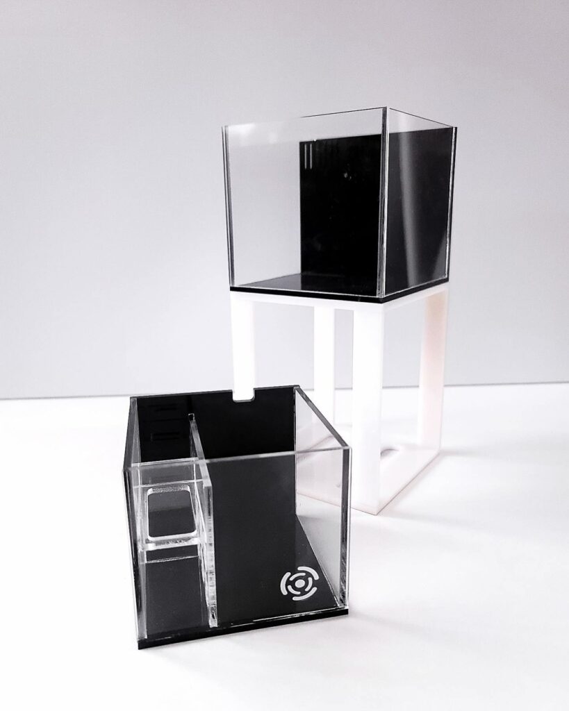 THE CUBE, shown here with a white stand.